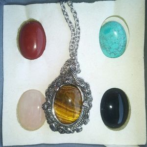 Long pendant with changeable stones